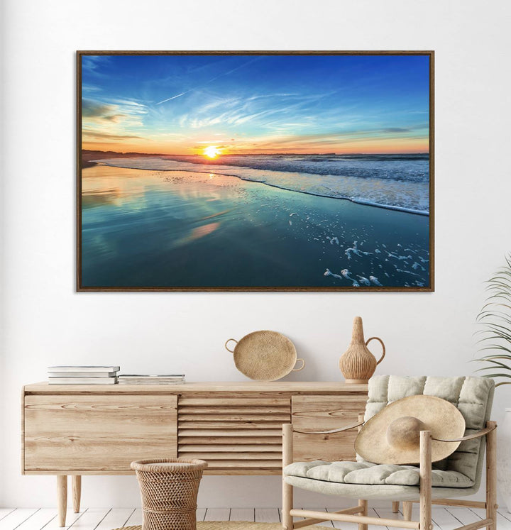 The Blue Sky and Beach Wall Art Canvas Print features a vibrant orange sky reflecting on wet sand.