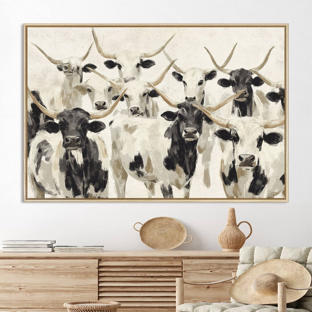 Canvas print titled Longhorn Texas Cow Drawing, depicting longhorn cattle with black and white markings, made in the USA, displayed on the wall.