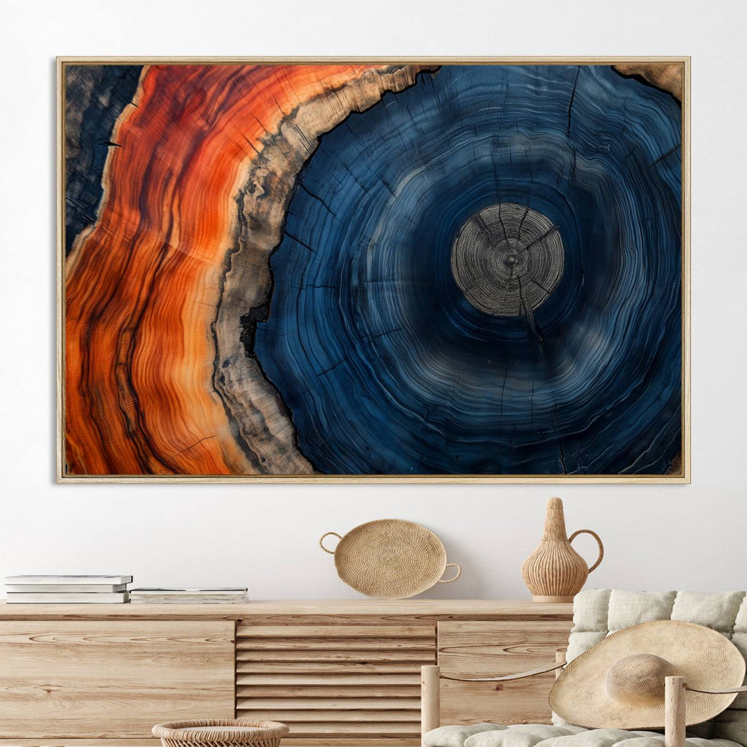 Abstract Tree Ring Wall Art Print on canvas featuring vibrant blue, orange, and brown rings with a natural rustic wood texture. Free shipping available!.