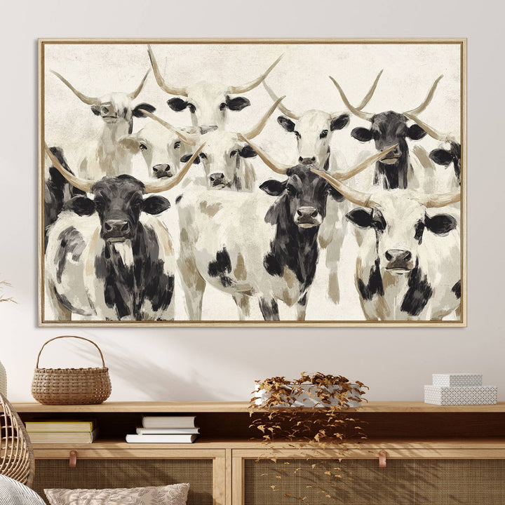 Canvas print titled Longhorn Texas Cow Drawing, depicting longhorn cattle with black and white markings, made in the USA, displayed on the wall.