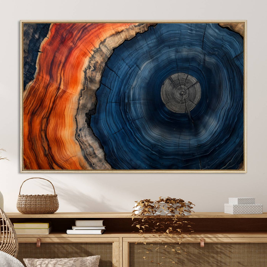 Abstract Tree Ring Wall Art Print on canvas featuring vibrant blue, orange, and brown rings with a natural rustic wood texture. Free shipping available!.