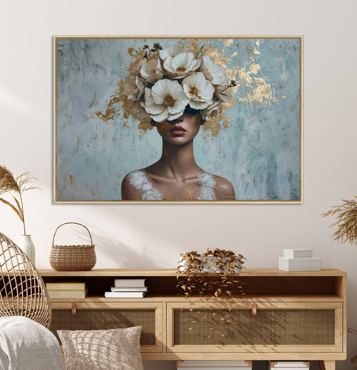 Golden Petal Wall Art: A womans face adorned with a gold floral design on a teal background, presented in a 3-panel modern glam canvas.