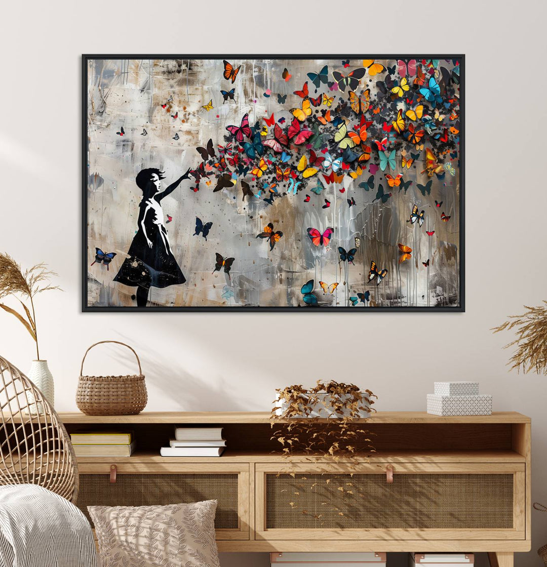 The Banksy Butterfly Girl 3-Piece Modern Graffiti Canvas Wall Art features a silhouette of a girl reaching for butterflies.