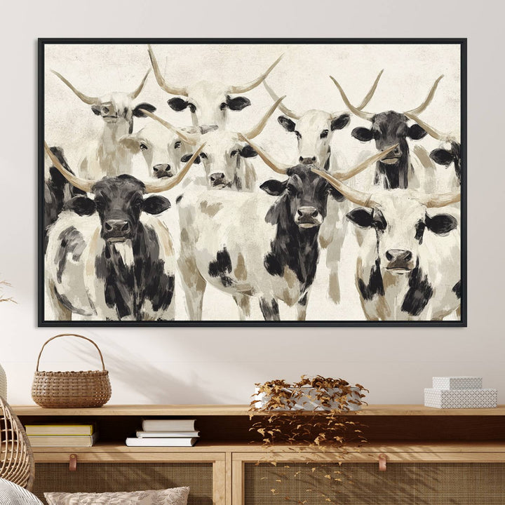 Canvas print titled Longhorn Texas Cow Drawing, depicting longhorn cattle with black and white markings, made in the USA, displayed on the wall.