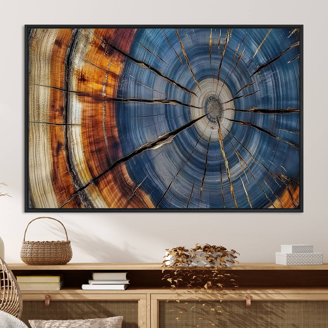 Close-up of blue, brown, and orange wood grain rings on the Abstract Tree Rings Canvas Wall Art Print.