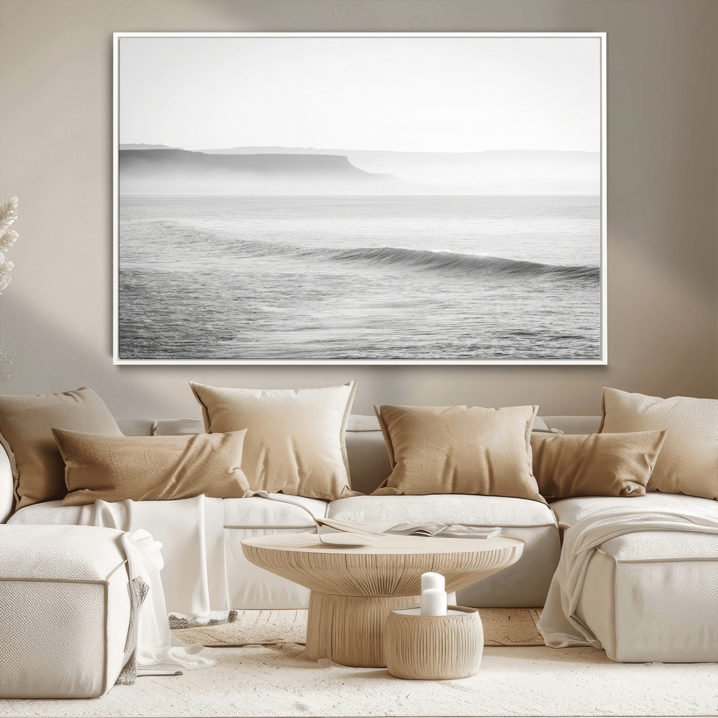 A black and white minimalist seascape featuring soft rolling waves and misty distant cliffs, creating a serene and timeless coastal atmosphere.