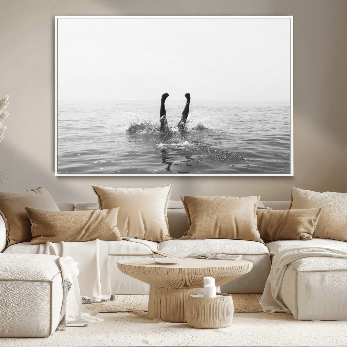 A black and white minimalist water scene capturing a playful splash as a swimmer dives upside down, creating a carefree and artistic aquatic aesthetic.