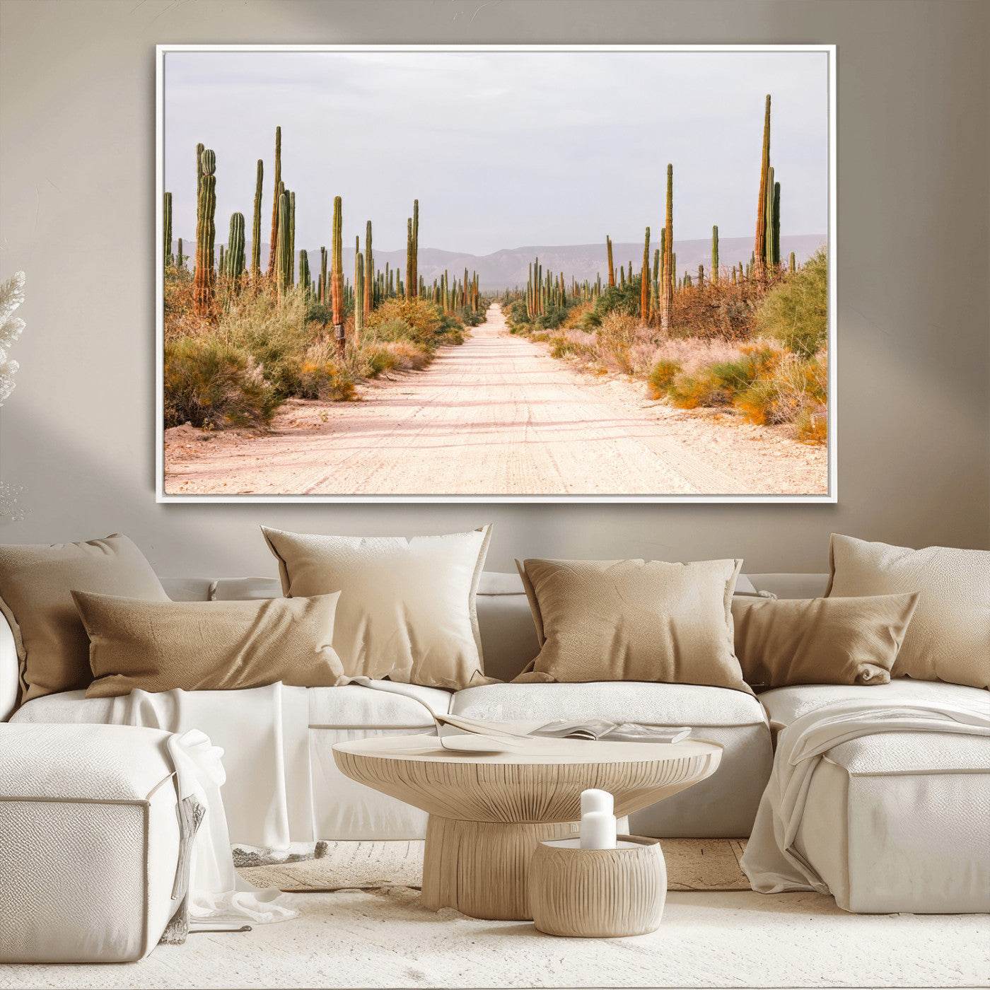 A desert road lined with saguaro cacti under a golden sky, creating a warm southwestern feel, perfect for boho or rustic decor.