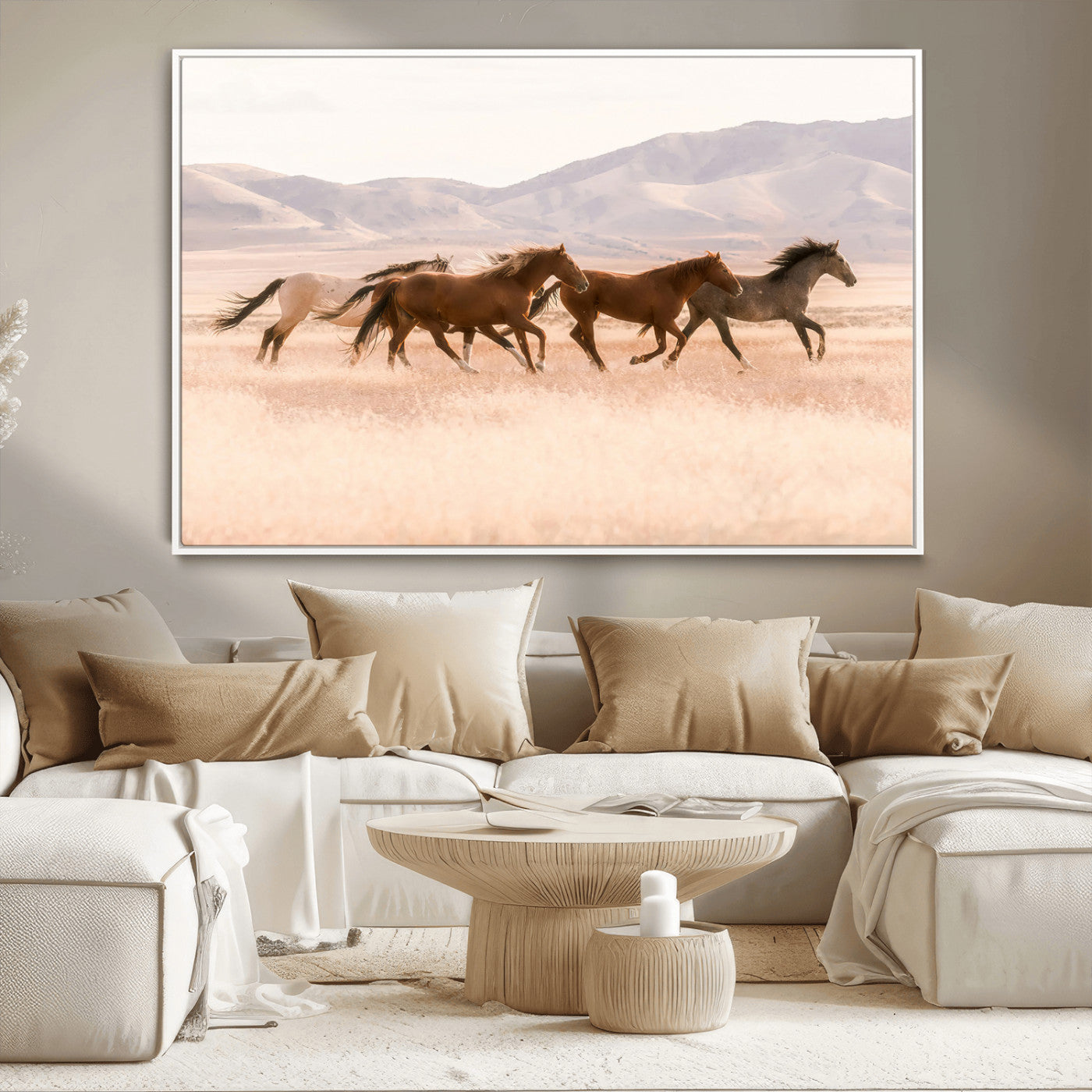 A herd of wild horses galloping through a sunlit desert plain with mountains in the background, perfect for rustic or western-themed wall decor.