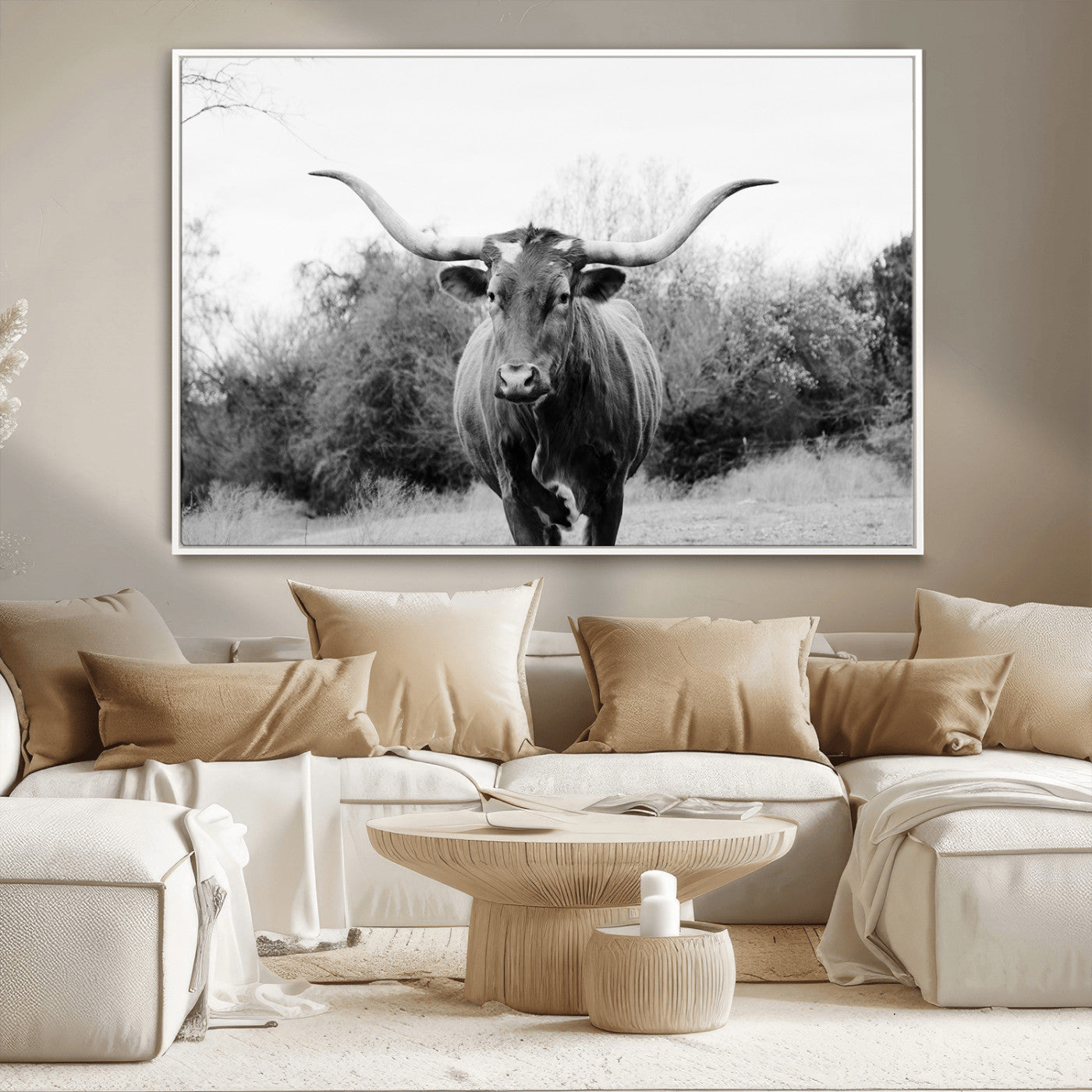 Black and white photo of a Longhorn cow facing camera, ideal for rustic, farmhouse, or western-themed home wall decor.