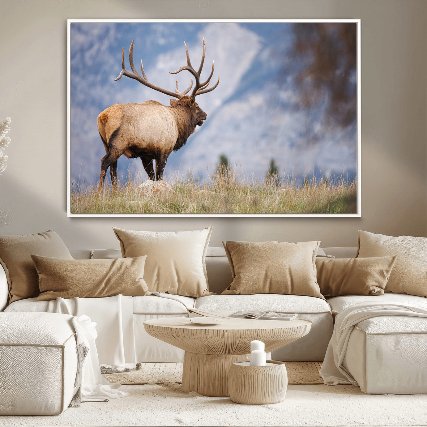 Elk with antlers standing on grass with mountain background, ideal for rustic, cabin, or lodge-inspired wall decor.