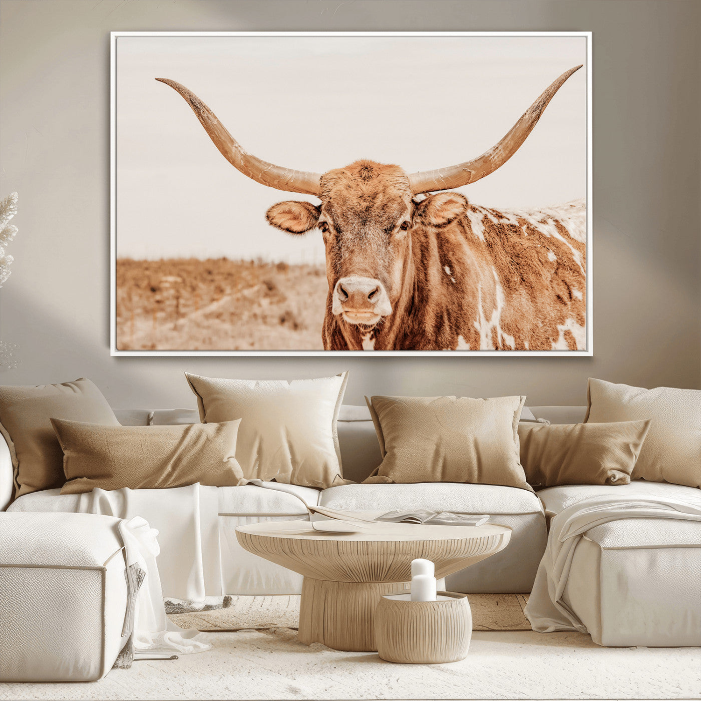 Sepia-toned Texas Longhorn facing forward in a dry field, perfect for rustic farmhouse or western-themed neutral home decor.