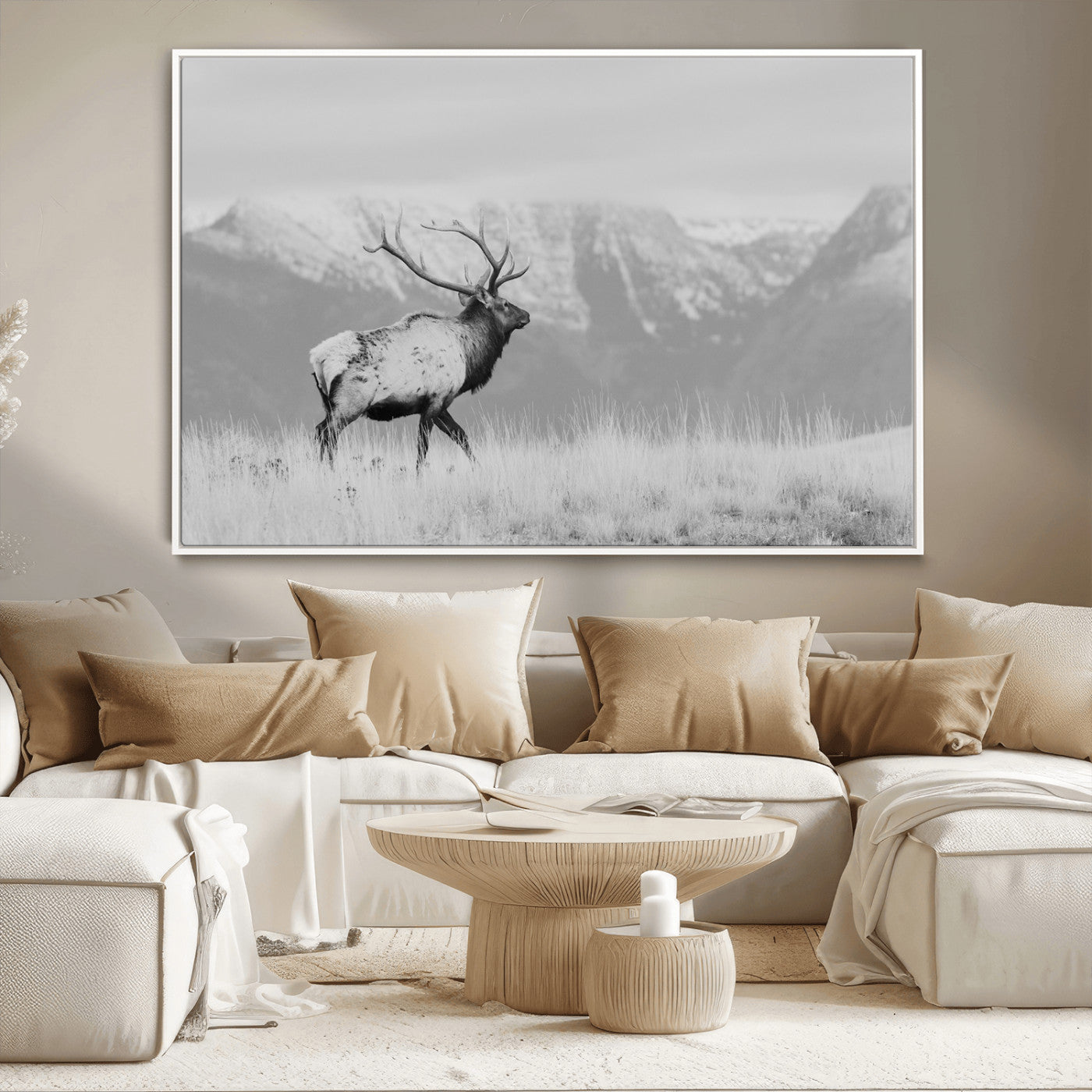 Black and white elk standing in front of snowy mountain range, perfect for rustic lodge or nature-inspired wall decor.