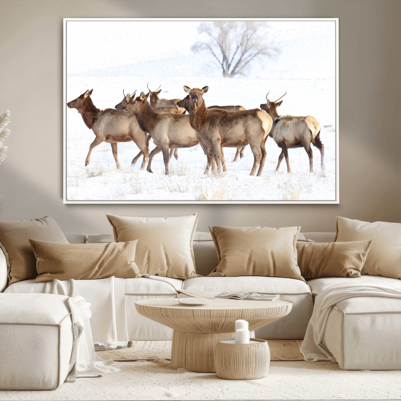 A group of elk standing on snowy terrain with a tree in the background, perfect for rustic or lodge-style winter wall decor.