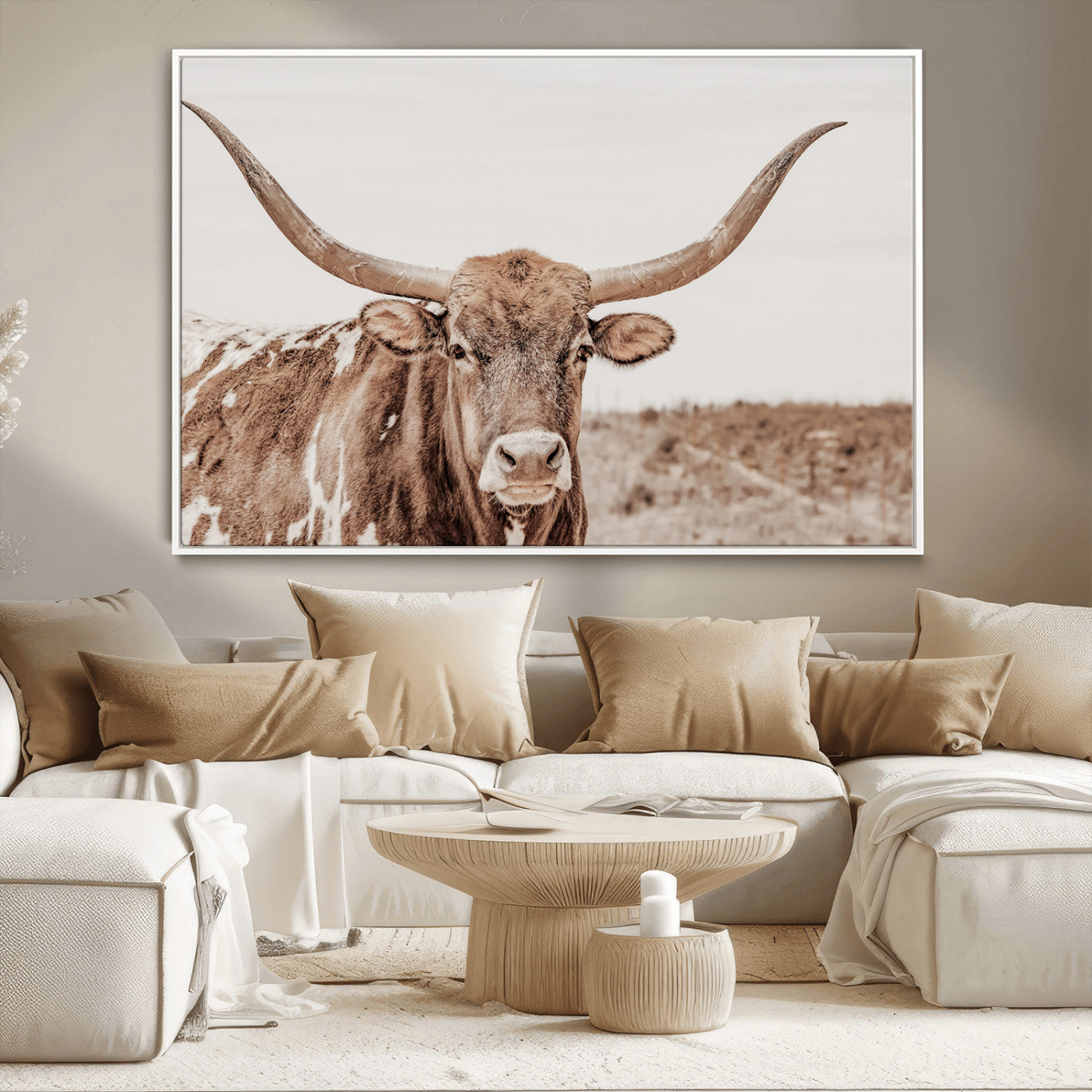 A longhorn cow in soft beige desert tones, standing calmly in open land, perfect for neutral western or rustic farmhouse interiors.