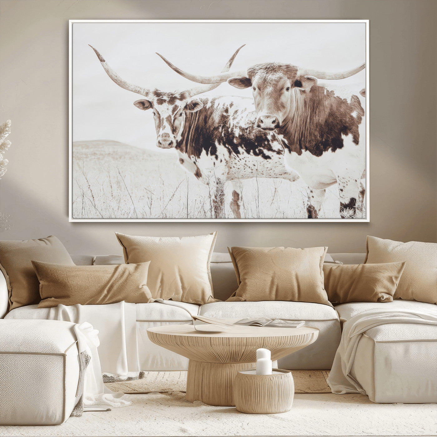 Two longhorn cattle standing in a dry grassy field with neutral tones, creating a rustic and farmhouse-inspired Western aesthetic.