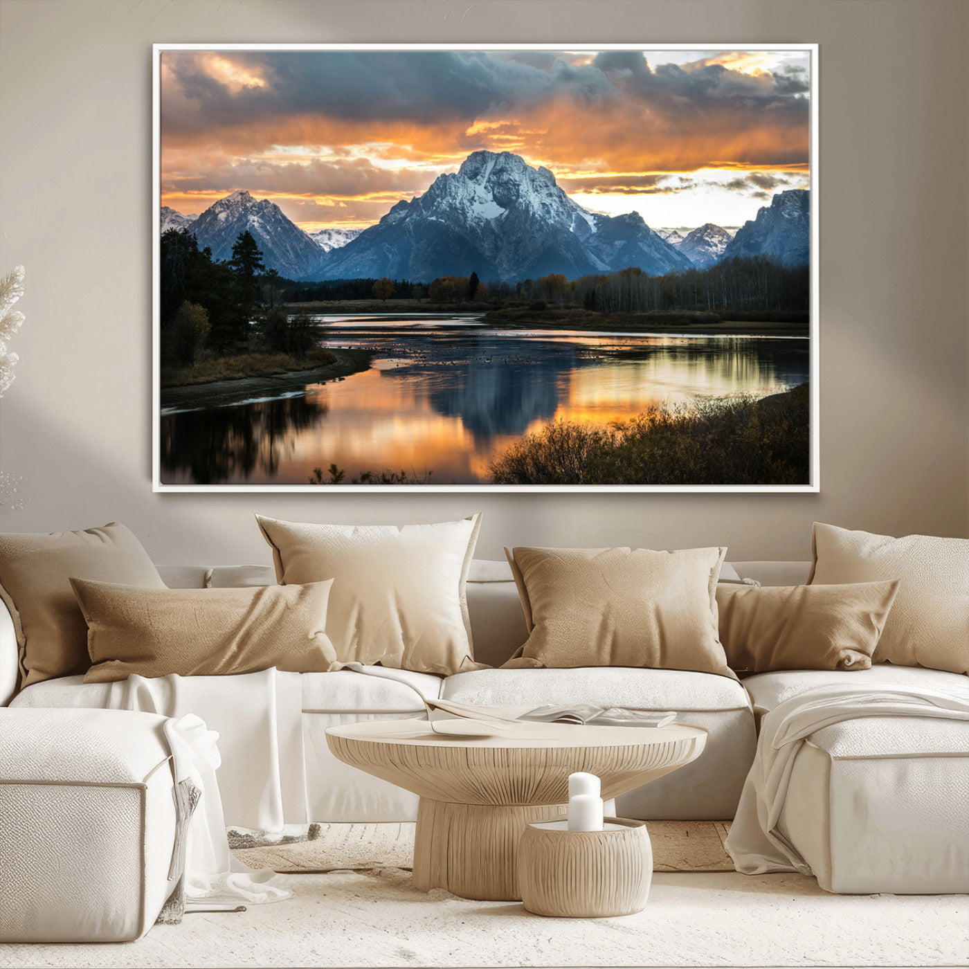 Snow-capped mountains reflecting in a calm lake at sunset, with a dramatic golden sky creating a breathtaking wilderness scene.