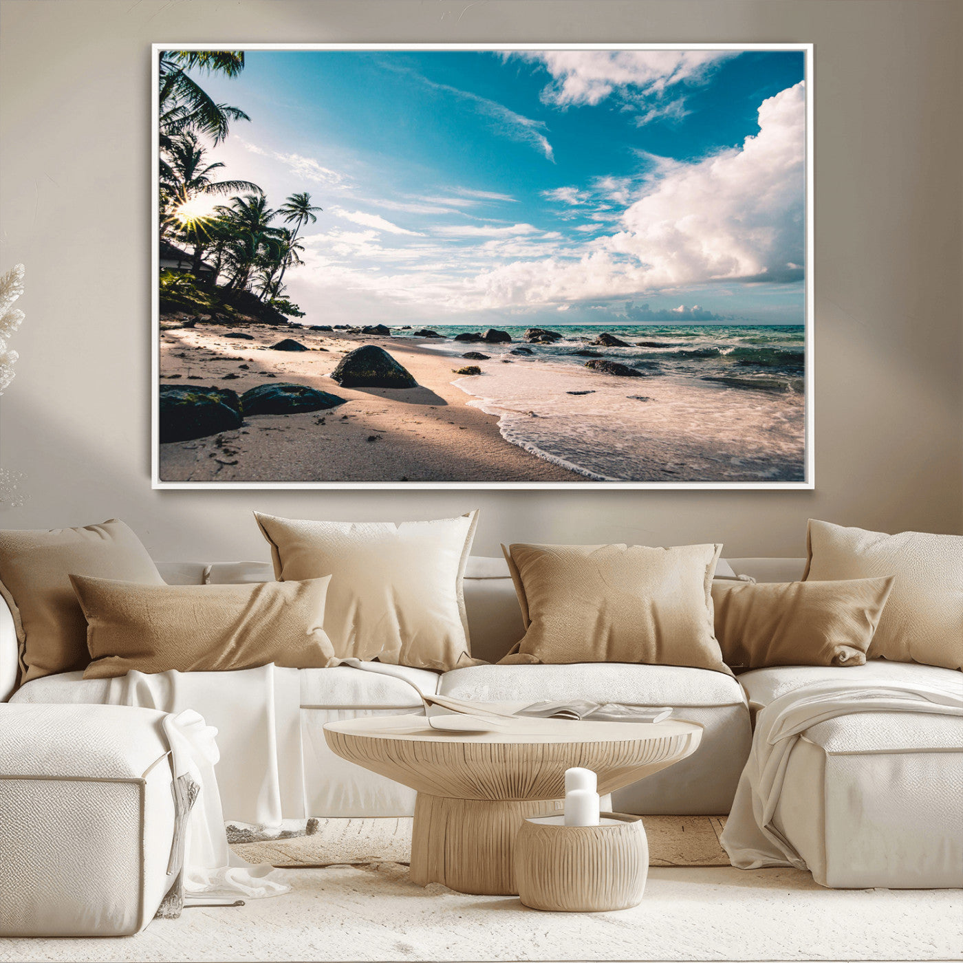 Scenic tropical beach with palm trees, ocean waves, and rocky shoreline under a bright blue sky, creating a serene coastal vibe.