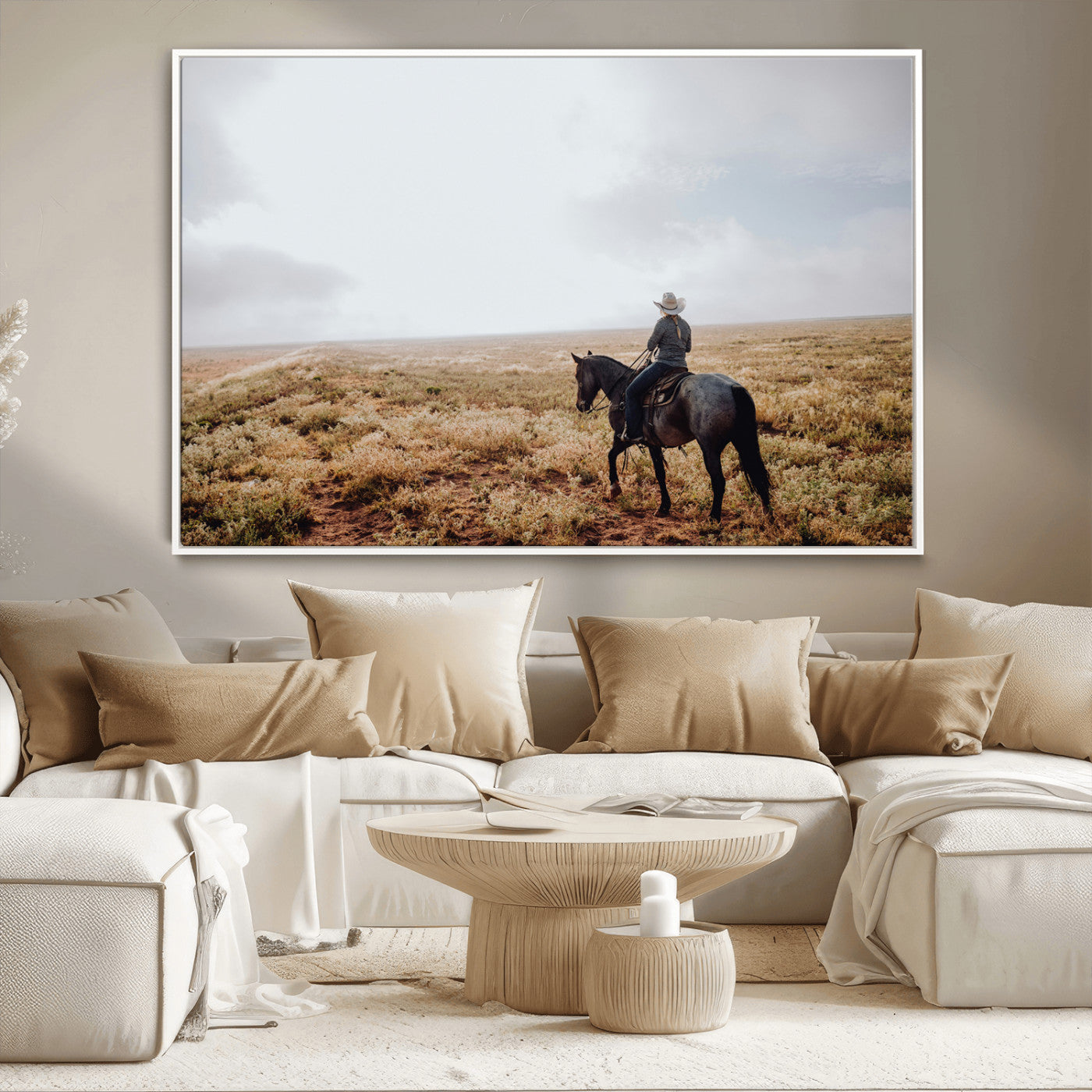 A lone cowboy riding horseback across an open prairie under a vast sky, capturing the rugged and timeless spirit of the Western frontier.
