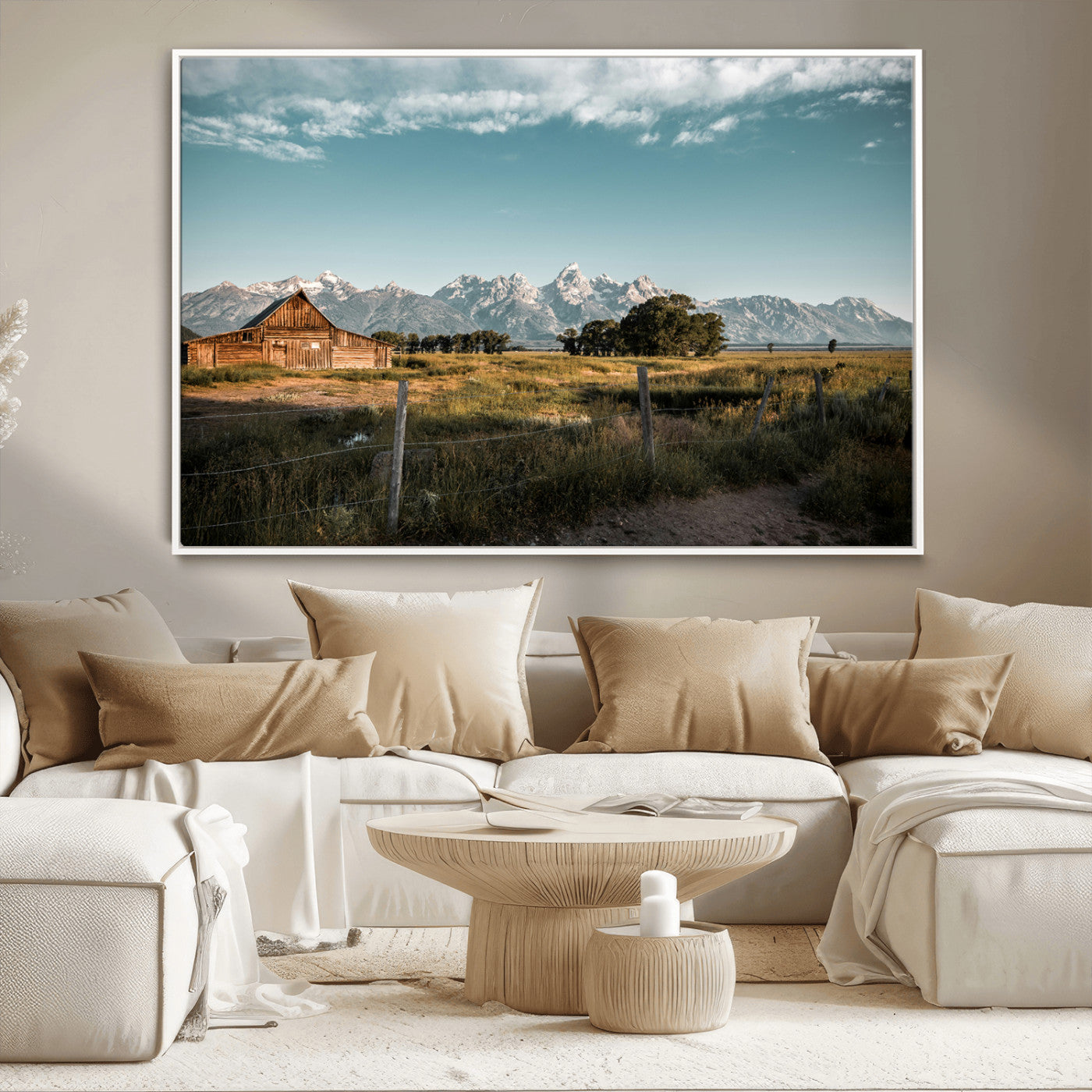 A rustic farmhouse with a wooden barn set against majestic mountain peaks under a soft blue sky, evoking peaceful countryside charm.