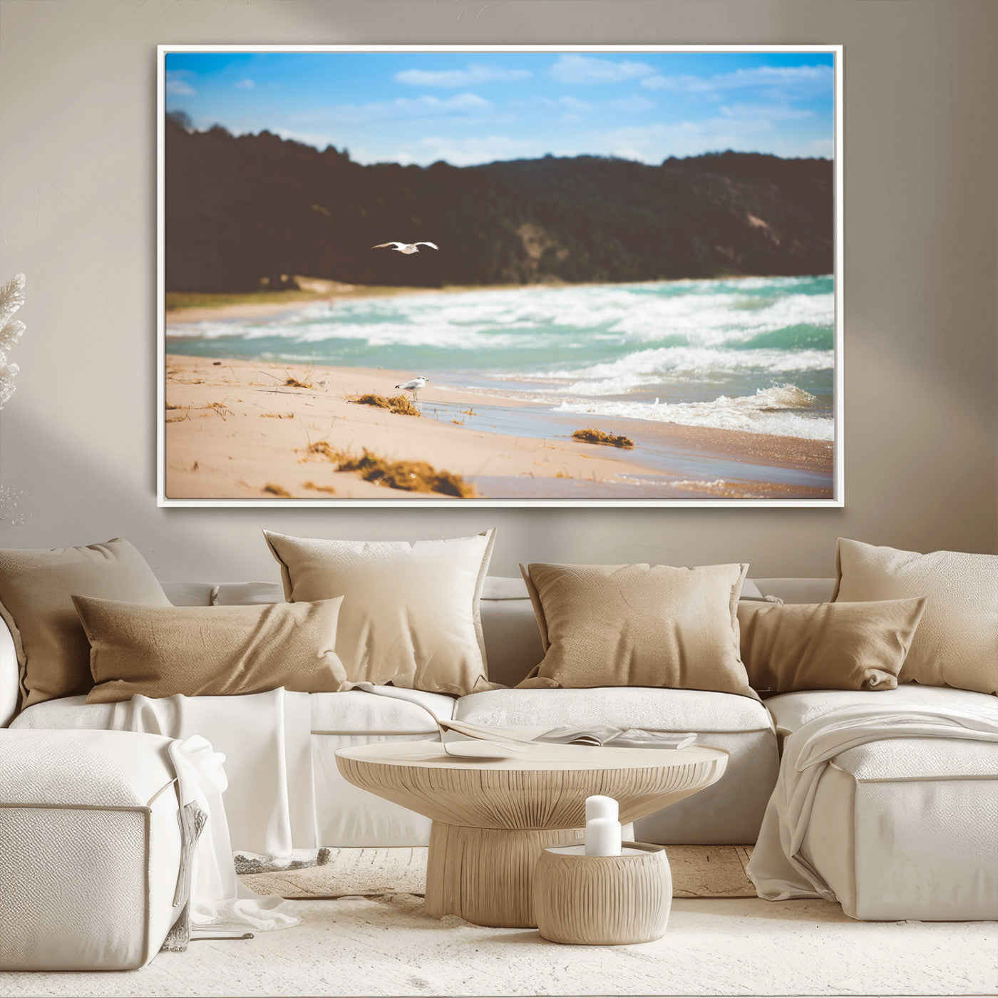 Serene beach scene with gentle ocean waves, sandy shore, and a seagull flying under a blue sky, perfect for coastal and nature-inspired decor.