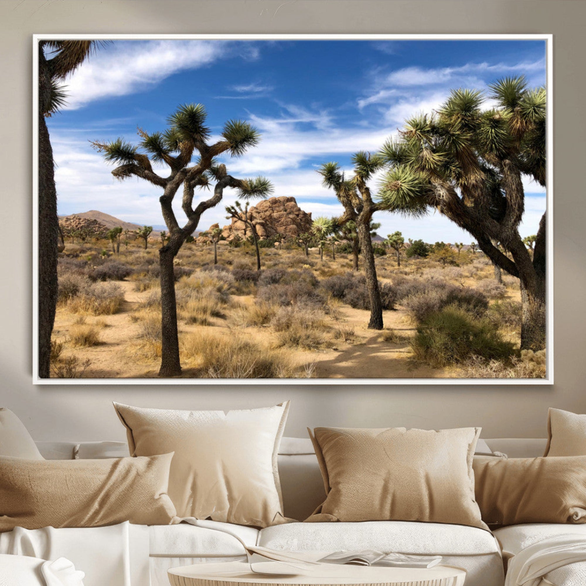 Scenic Joshua Tree landscape with rugged desert terrain, golden dry grass, and a deep blue sky, creating a warm, rustic Southwestern aesthetic.