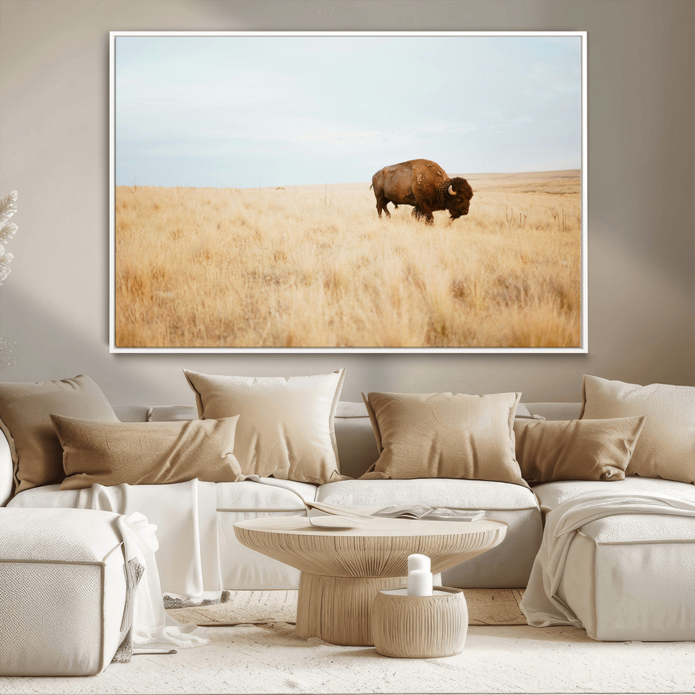 A lone bison standing in a vast golden grassland under a soft blue sky, evoking a rustic and Western aesthetic, ideal for farmhouse decor.