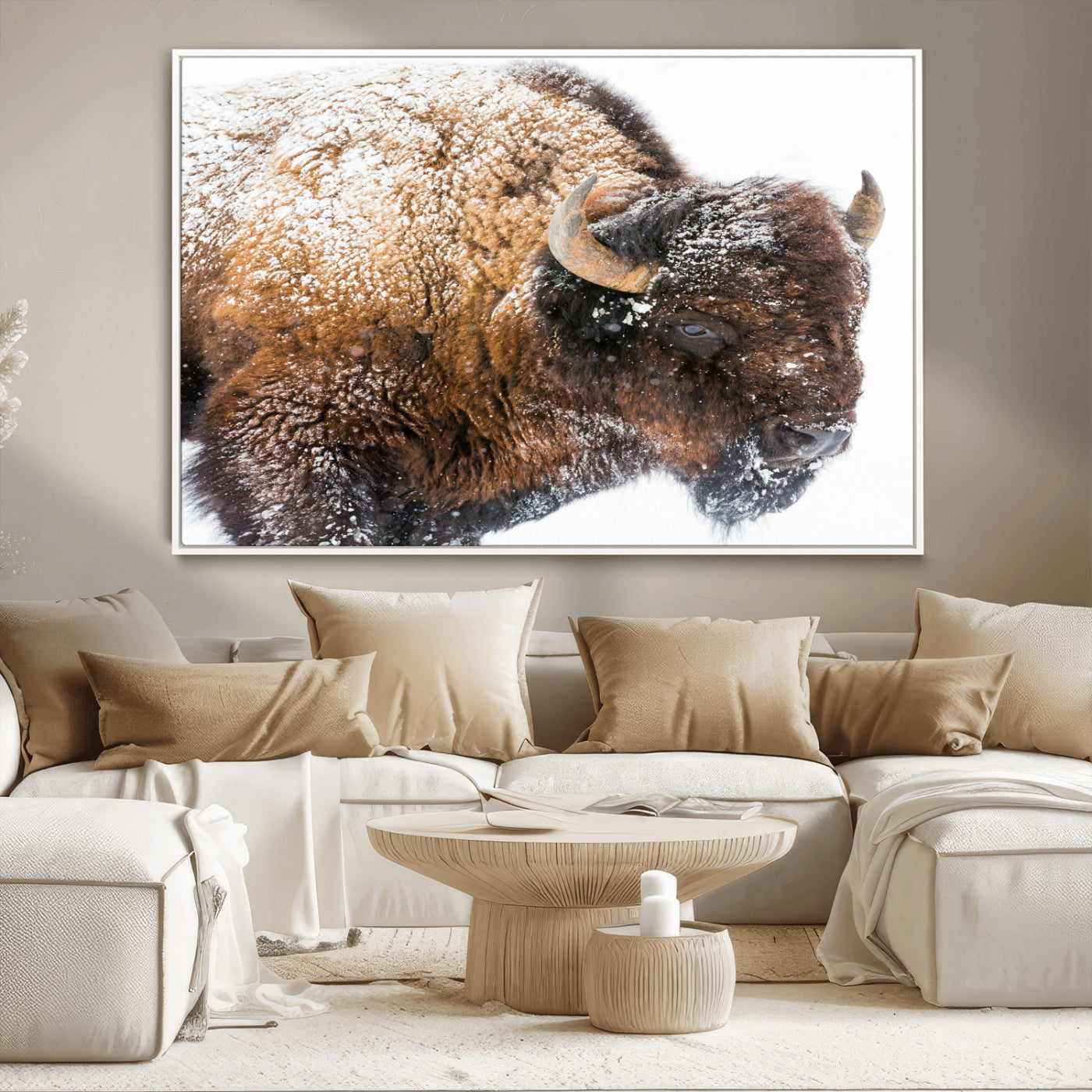 Close-up photograph of a bison covered in snow, highlighting its thick fur and powerful presence, set against a white winter backdrop, ideal for rustic decor.