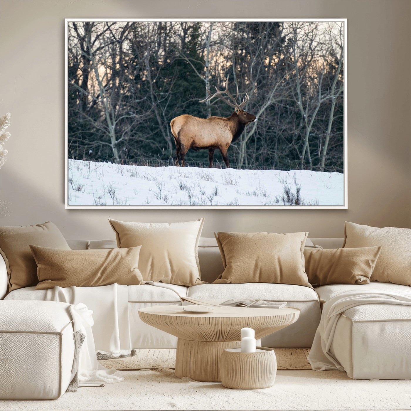 A majestic elk with large antlers standing in a snowy field against a winter forest backdrop, perfect for rustic and wildlife-themed home decor.