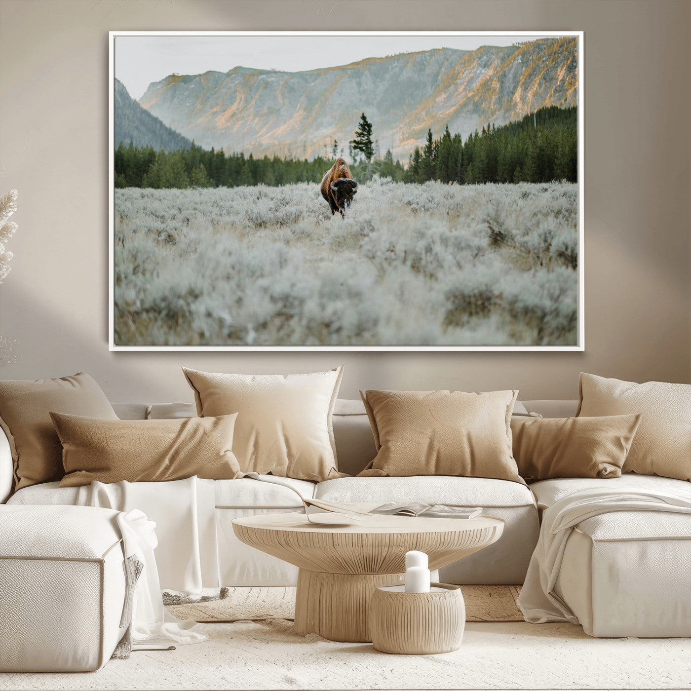 Lone bison standing in a frosted sagebrush field with a pine forest and rugged mountain range in the background under soft morning light – Wall Art Canvas Print.
