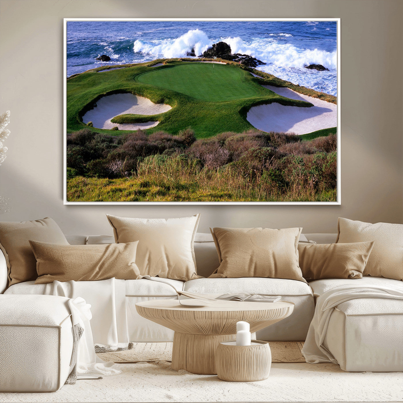 A scenic golf course located by the ocean, featuring a well-manicured green surrounded by sand traps and powerful ocean waves crashing on the shore.
