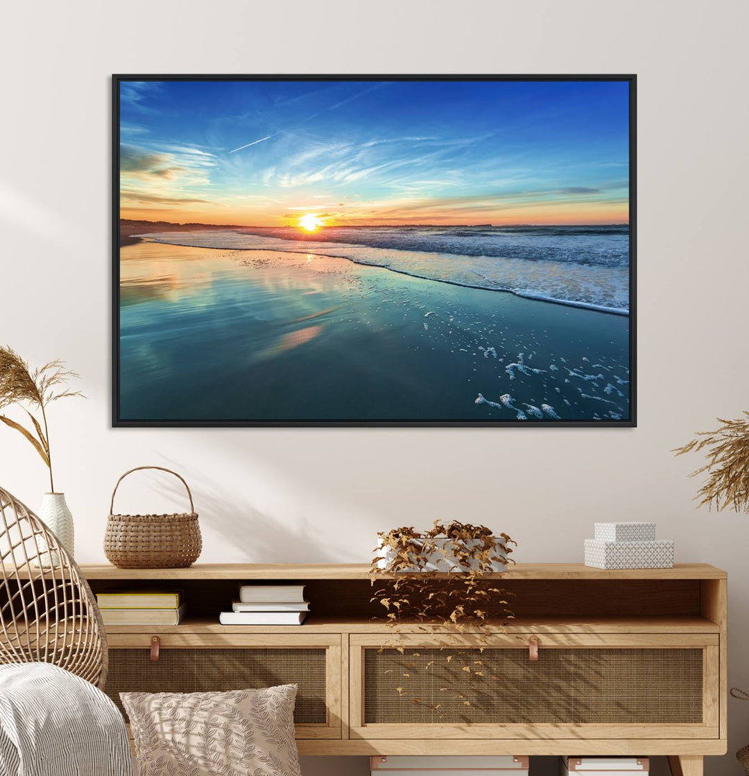 The Blue Sky and Beach Wall Art Canvas Print features a vibrant orange sky reflecting on wet sand.