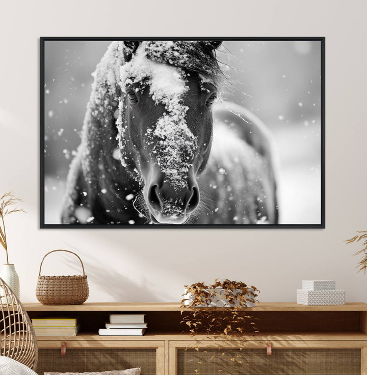 The Black and White Horse Winter Wall Art features a majestic horse with snow-covered hair set against a serene winter backdrop.