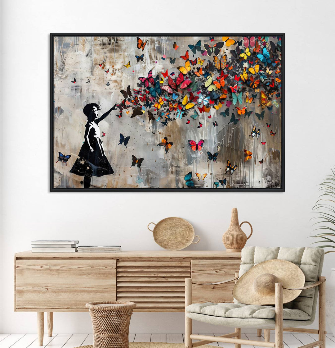 The Banksy Butterfly Girl 3-Piece Modern Graffiti Canvas Wall Art features a silhouette of a girl reaching for butterflies.