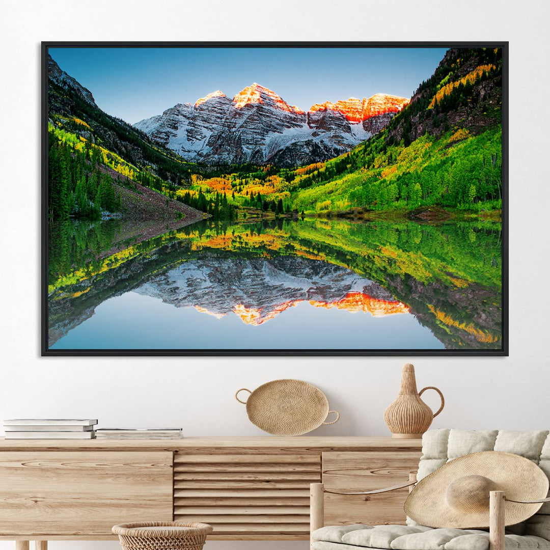 The Sunrise Maroon Bells Lake Wall Art Print beautifully captures North Maroon Peak mirrored in the tranquil lake, framed by lush greenery.