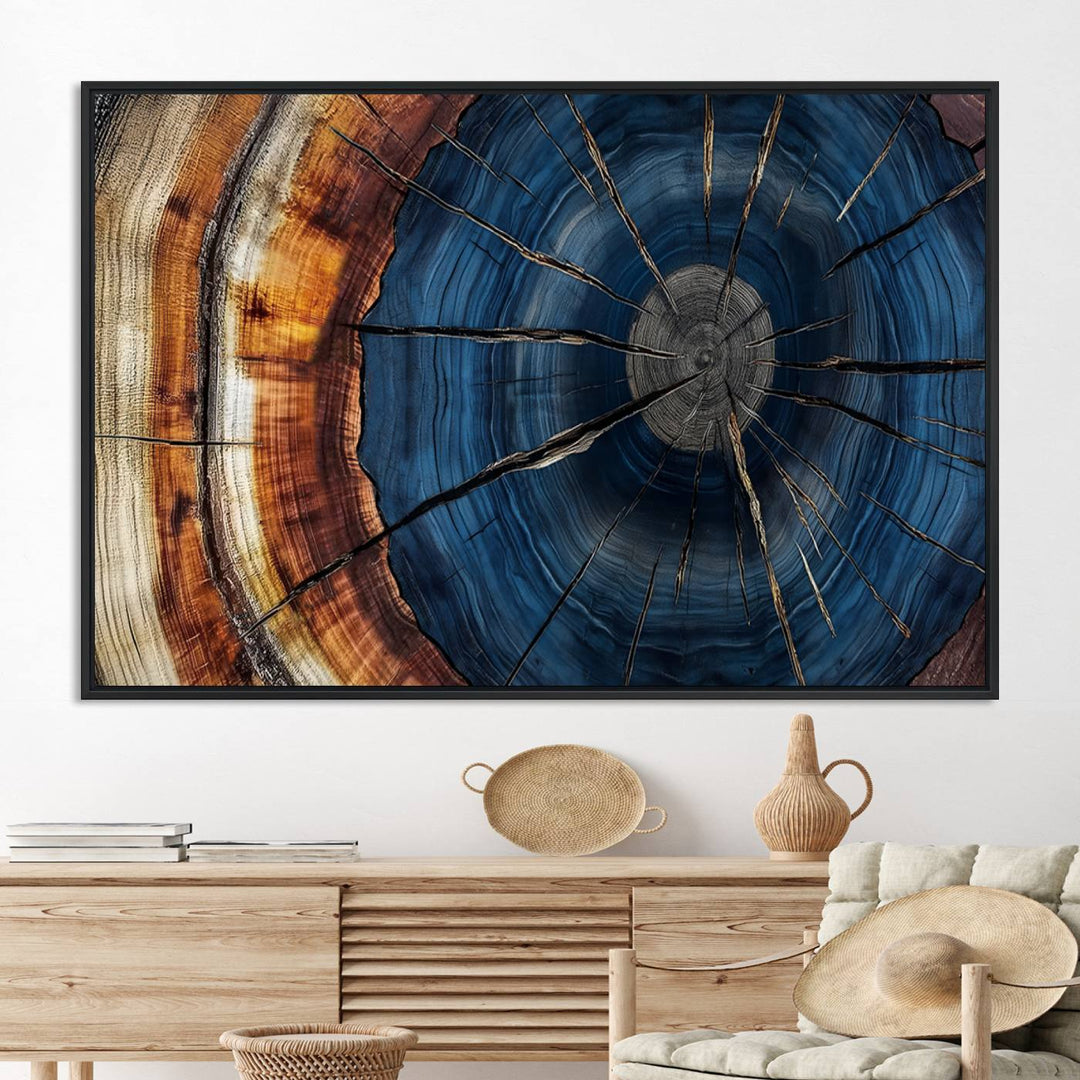 The Abstract Tree Rings Canvas Print features blue, brown, and orange rings that highlight wood grain and natures beauty.