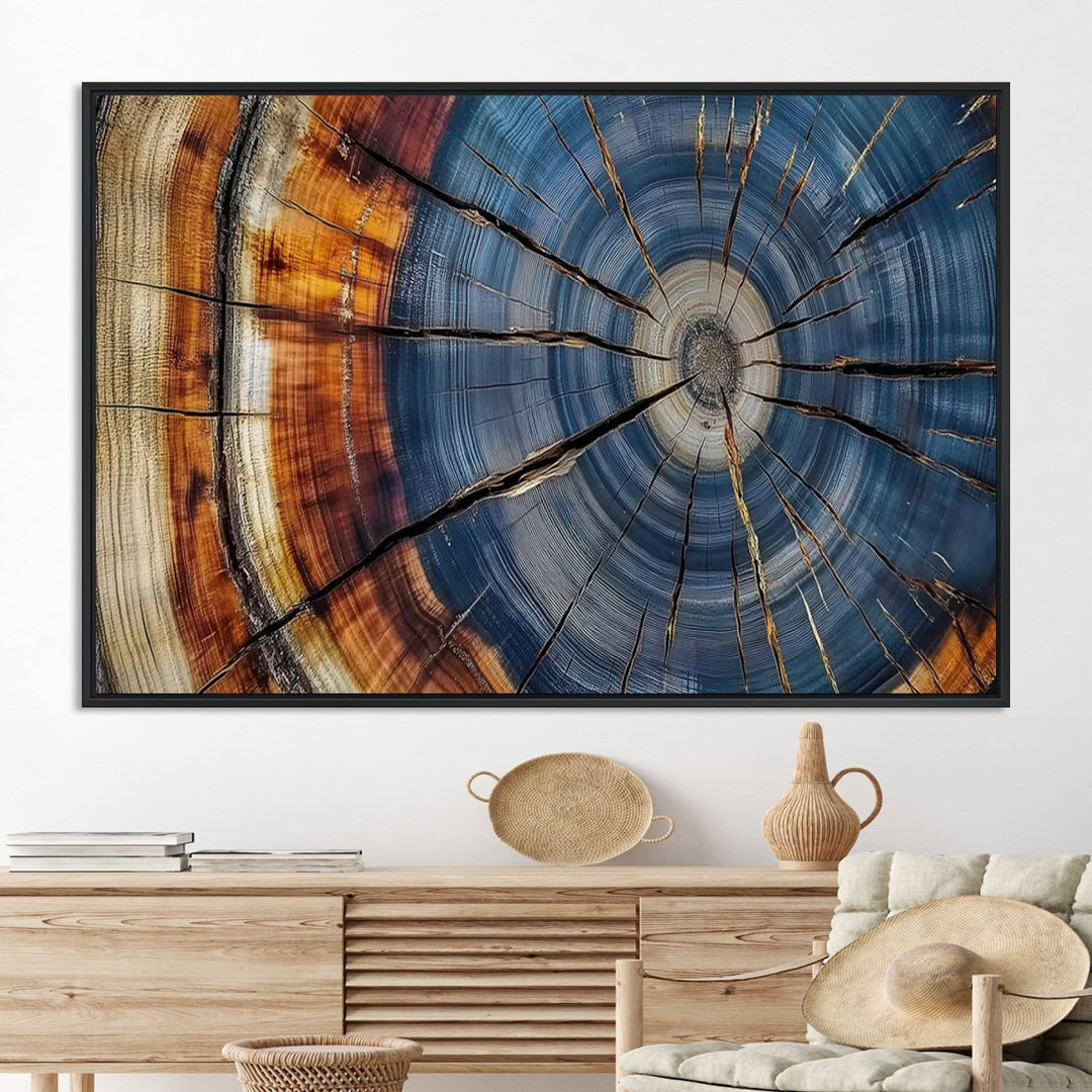 Close-up of blue, brown, and orange wood grain rings on the Abstract Tree Rings Canvas Wall Art Print.