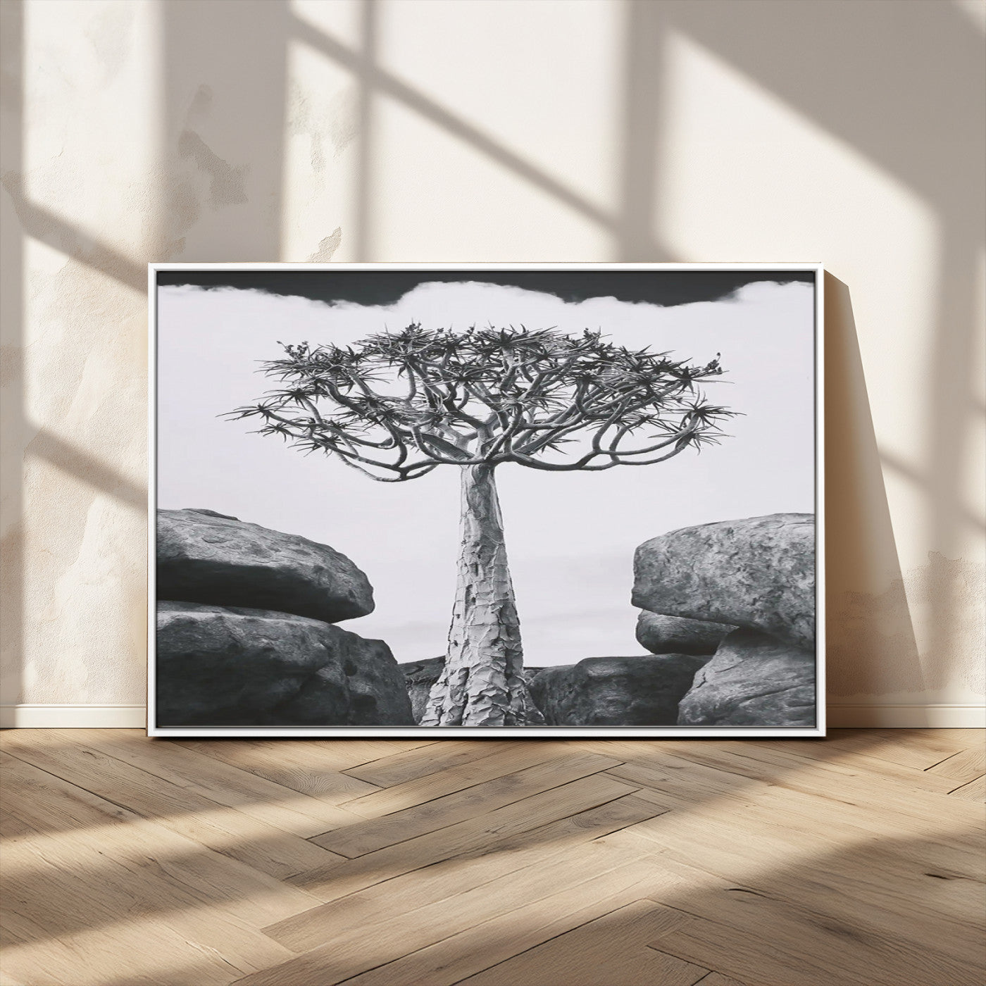 Black and white Joshua tree with bold rocky background, ideal for minimalist or desert-inspired home wall decoration.