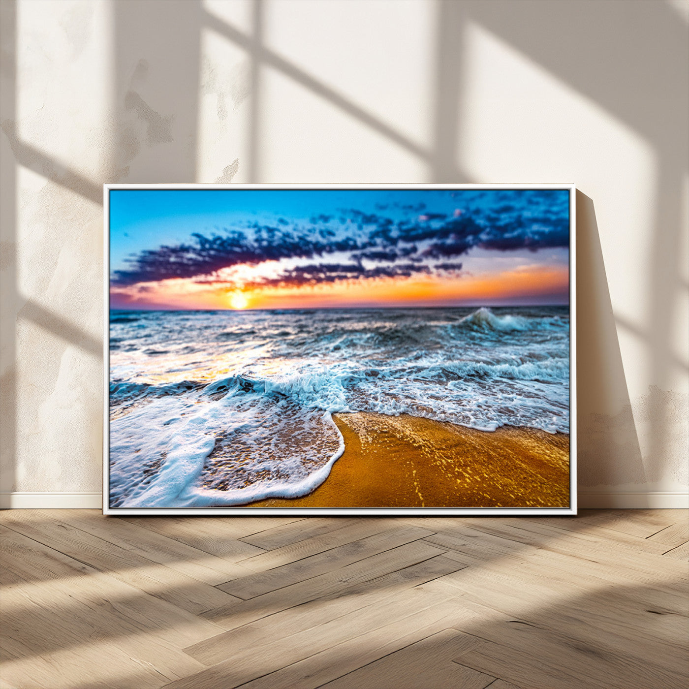 Beautiful ocean shoreline at sunset with foamy waves washing onto golden sand under a colorful sky – Wall Art Canvas Print.