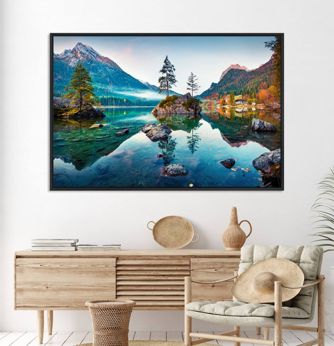 The 3-panel wall art showcases a serene mountain lake with rocky islands and trees, creating an ideal focal point for dining rooms or offices.