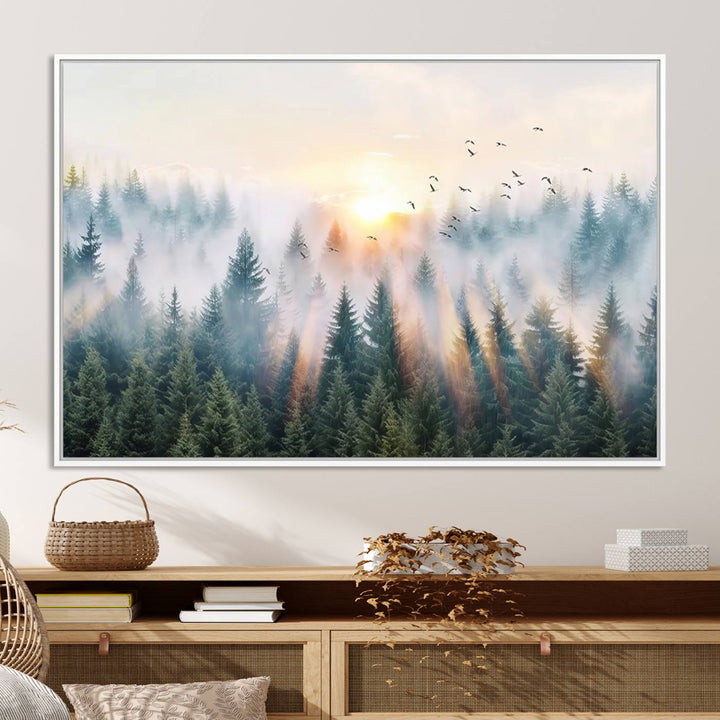 Misty Pine Forest Wall Art: A depiction of sunrise over foggy trees and birds against a bright sky; a framed woodland scene ideal for home or office decor.