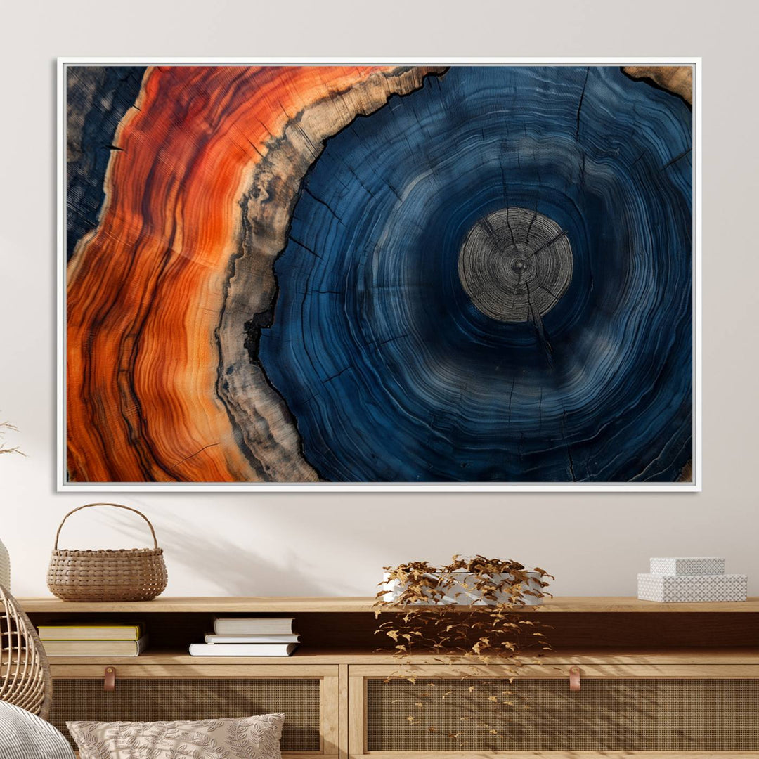 Abstract Tree Ring Wall Art Print on canvas featuring vibrant blue, orange, and brown rings with a natural rustic wood texture. Free shipping available!.