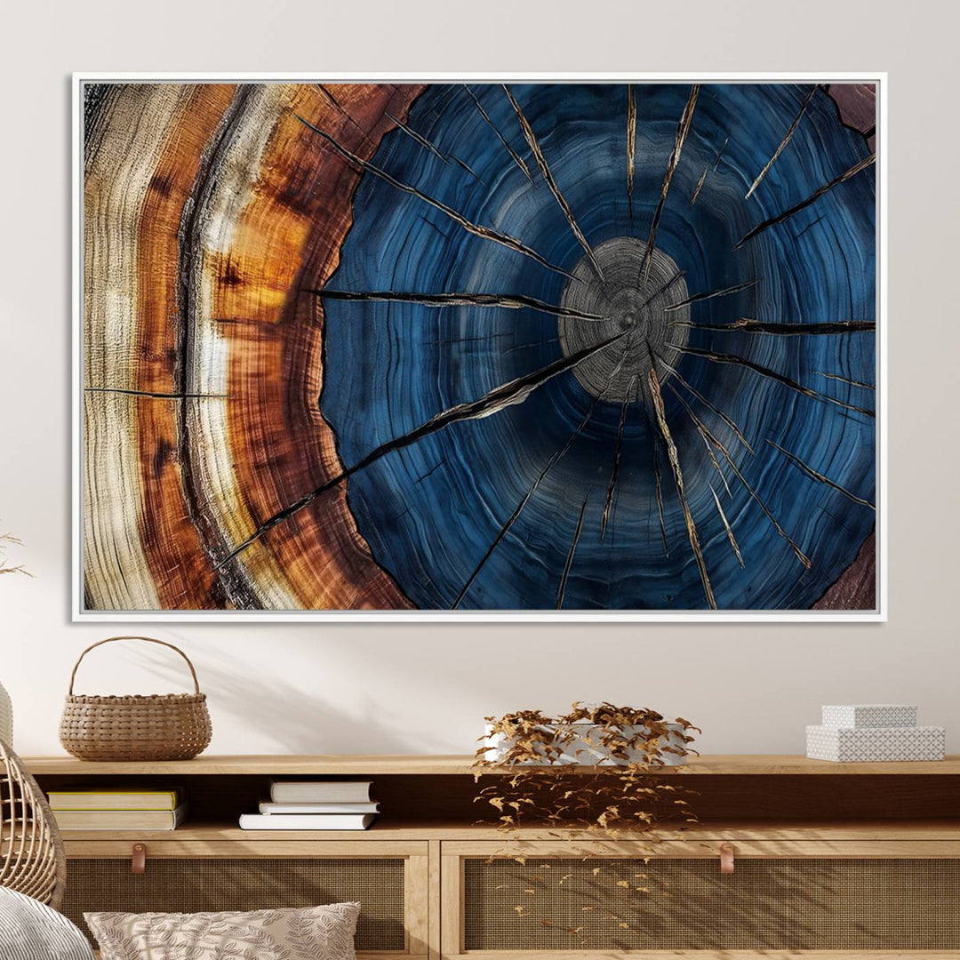 The Abstract Tree Rings Canvas Print features blue, brown, and orange rings that highlight wood grain and natures beauty.