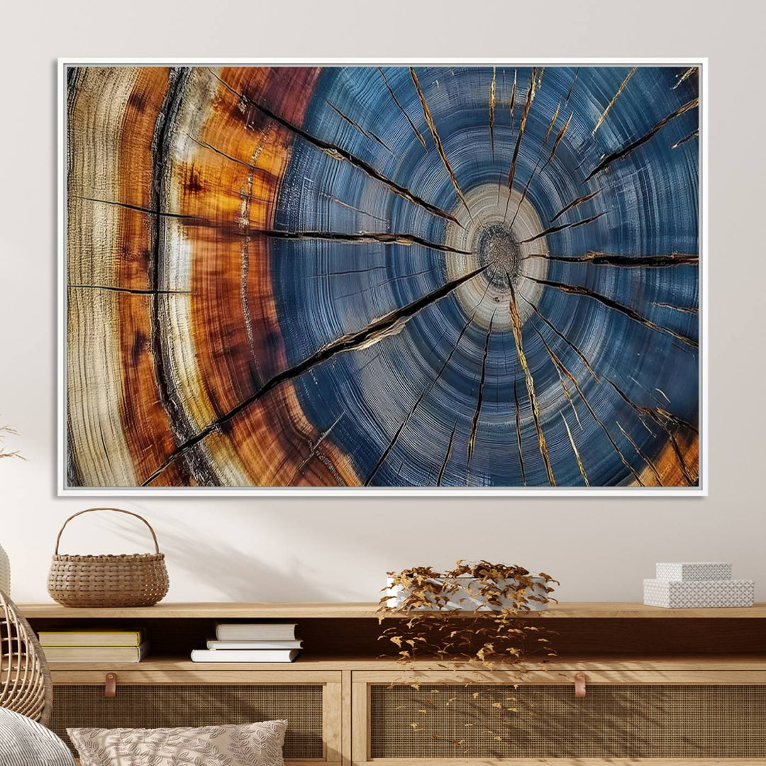 Close-up of blue, brown, and orange wood grain rings on the Abstract Tree Rings Canvas Wall Art Print.