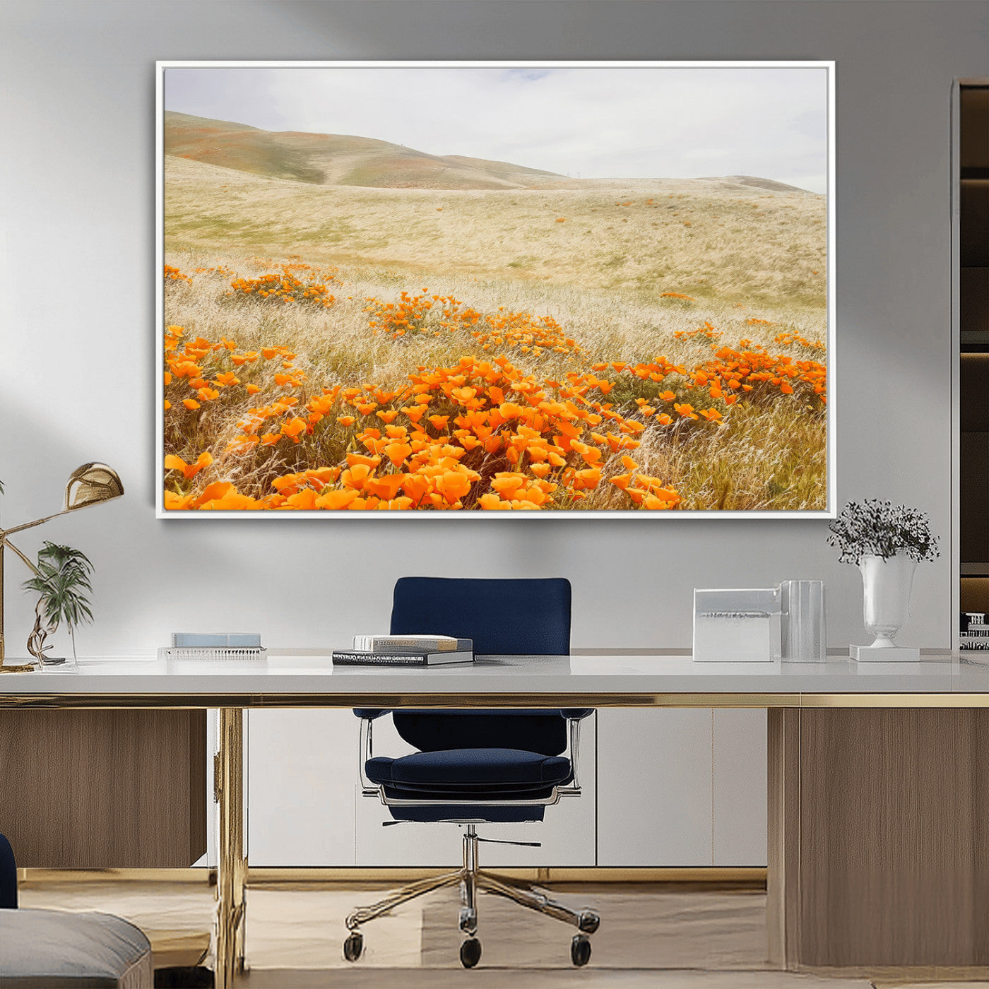 A golden field with vibrant orange poppies blooming across rolling hills under a soft, sunlit sky, creating a warm and rustic landscape.