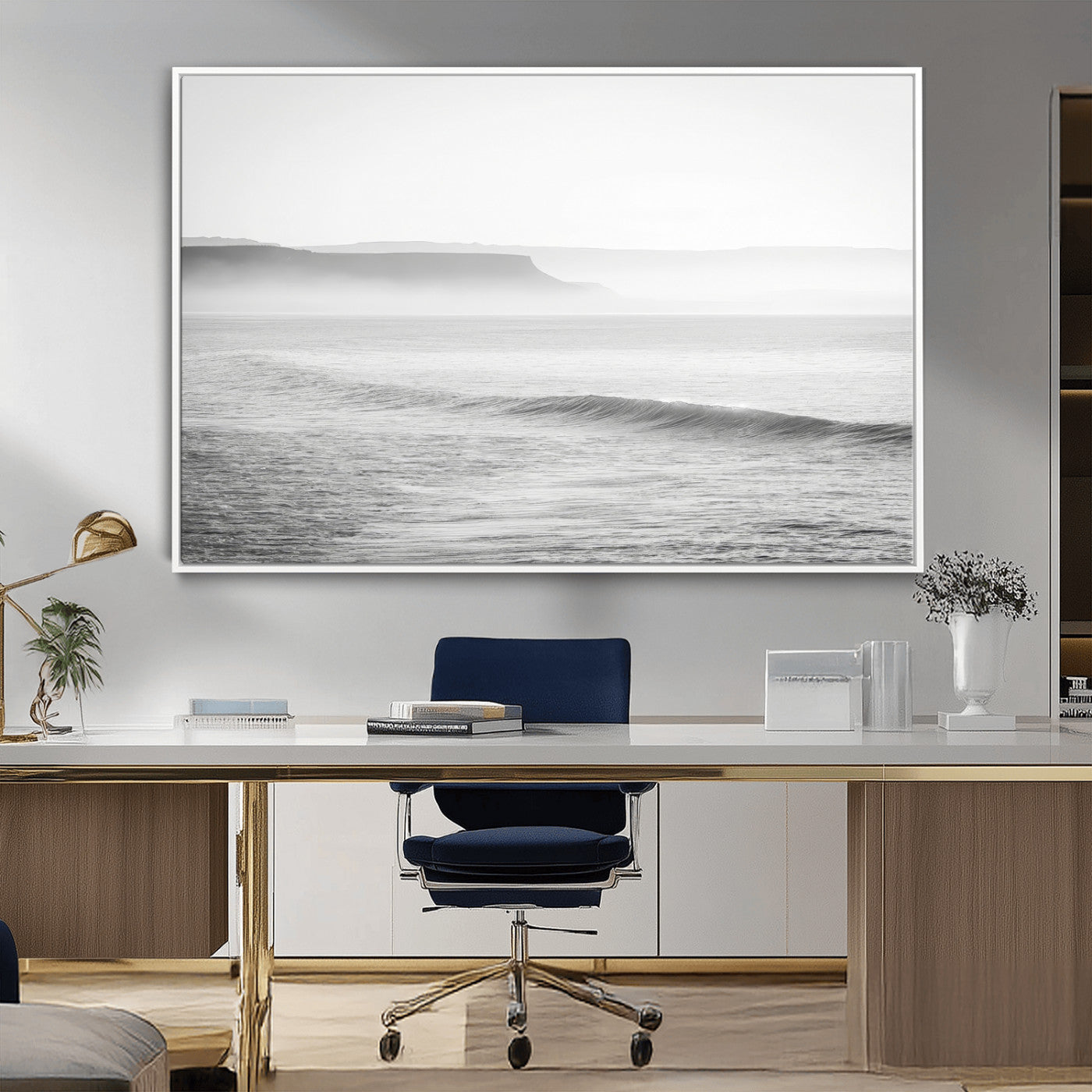 A black and white minimalist seascape featuring soft rolling waves and misty distant cliffs, creating a serene and timeless coastal atmosphere.