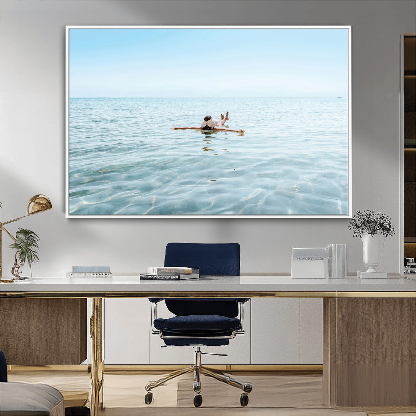 A peaceful minimalist scene of a person floating on crystal-clear water, surrounded by a vast open horizon, capturing relaxation and serenity in a tranquil aquatic setting.
