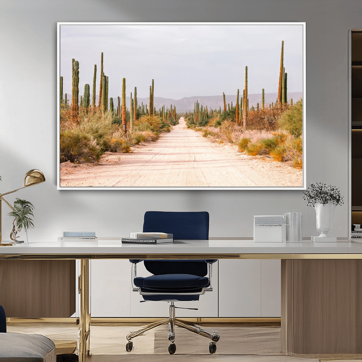 A desert road lined with saguaro cacti under a golden sky, creating a warm southwestern feel, perfect for boho or rustic decor.