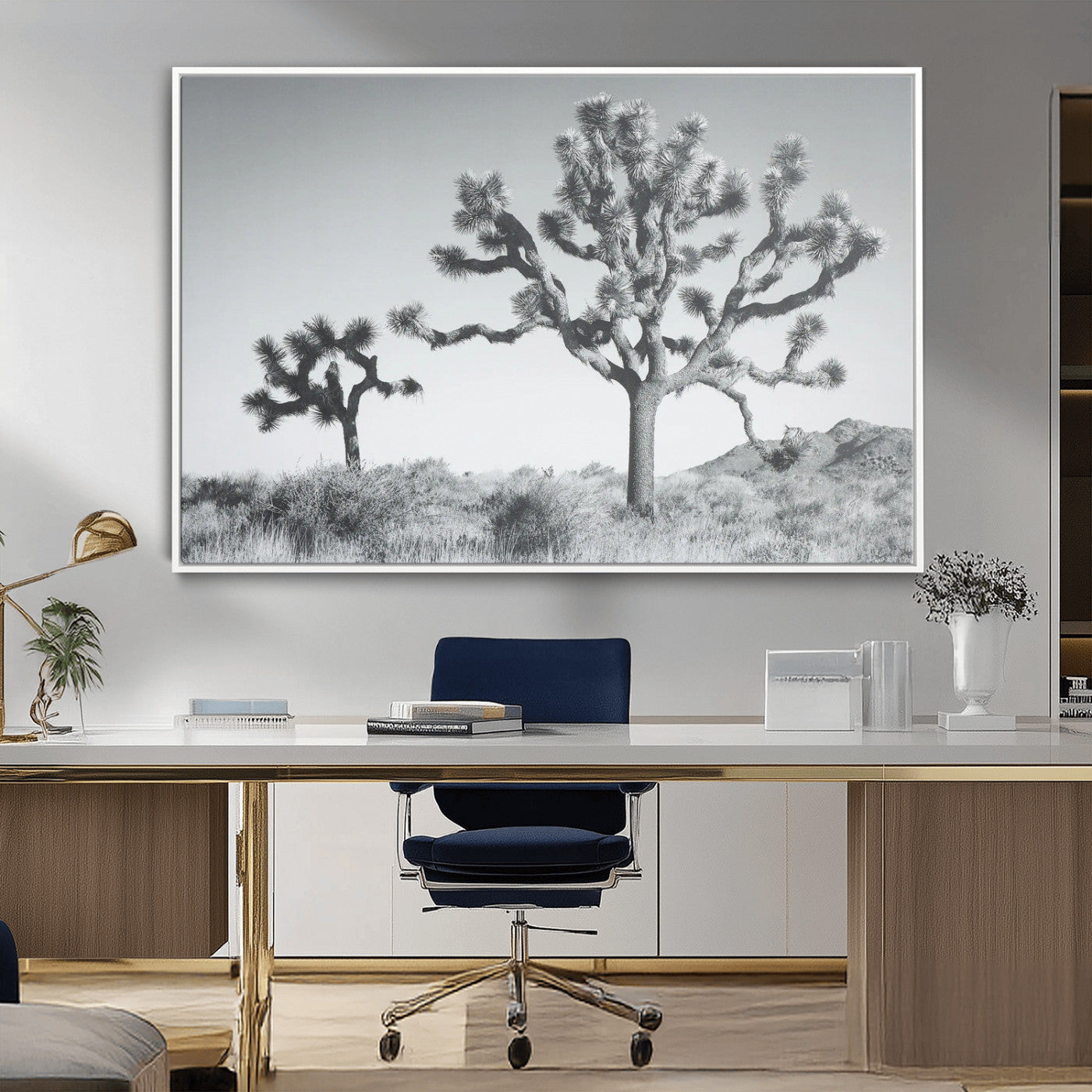 Two Joshua trees in a black and white desert landscape with distant hills, ideal for boho or rustic interior wall styling.