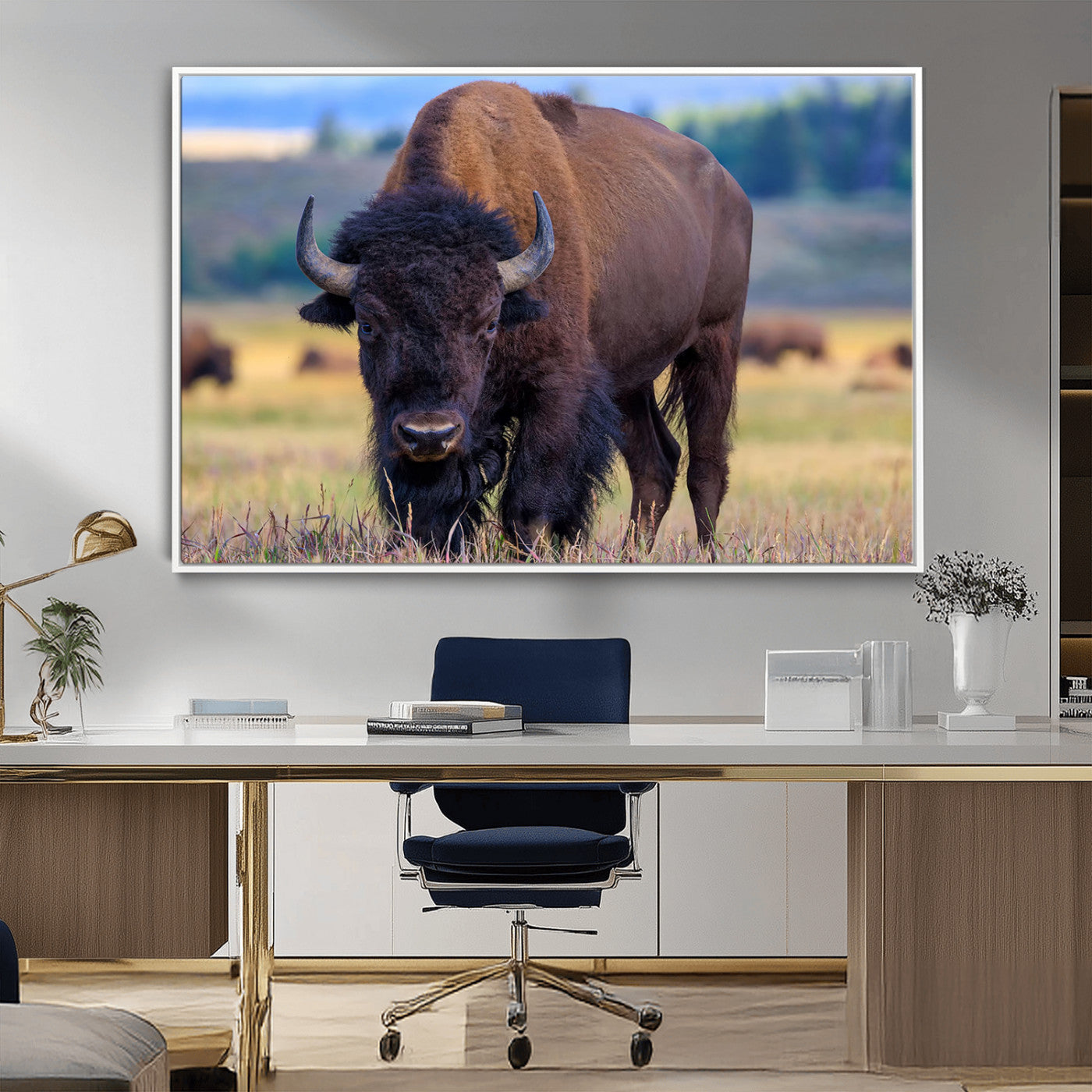 Close-up of a strong American bison standing in a grassy prairie with a blurred herd in background, perfect for rustic lodge decor.